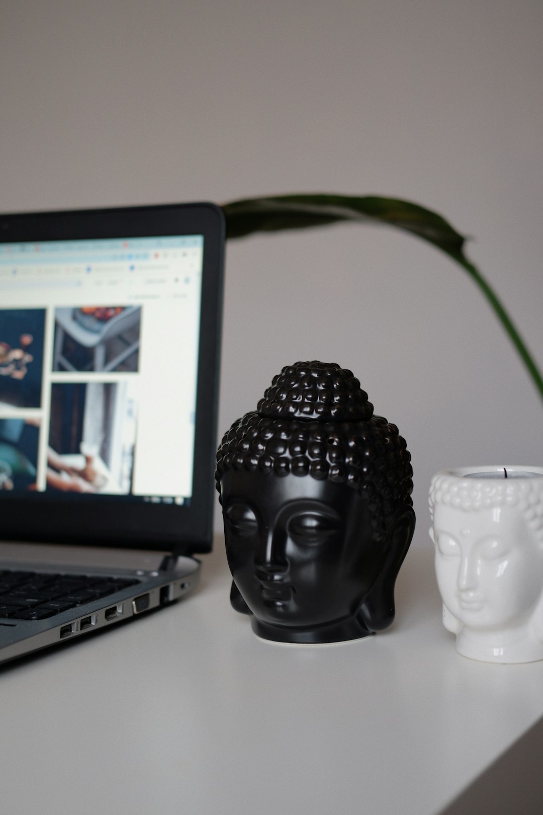 a-laptop-computer-sitting-on-top-of-a-white-desk-owshoexkh20